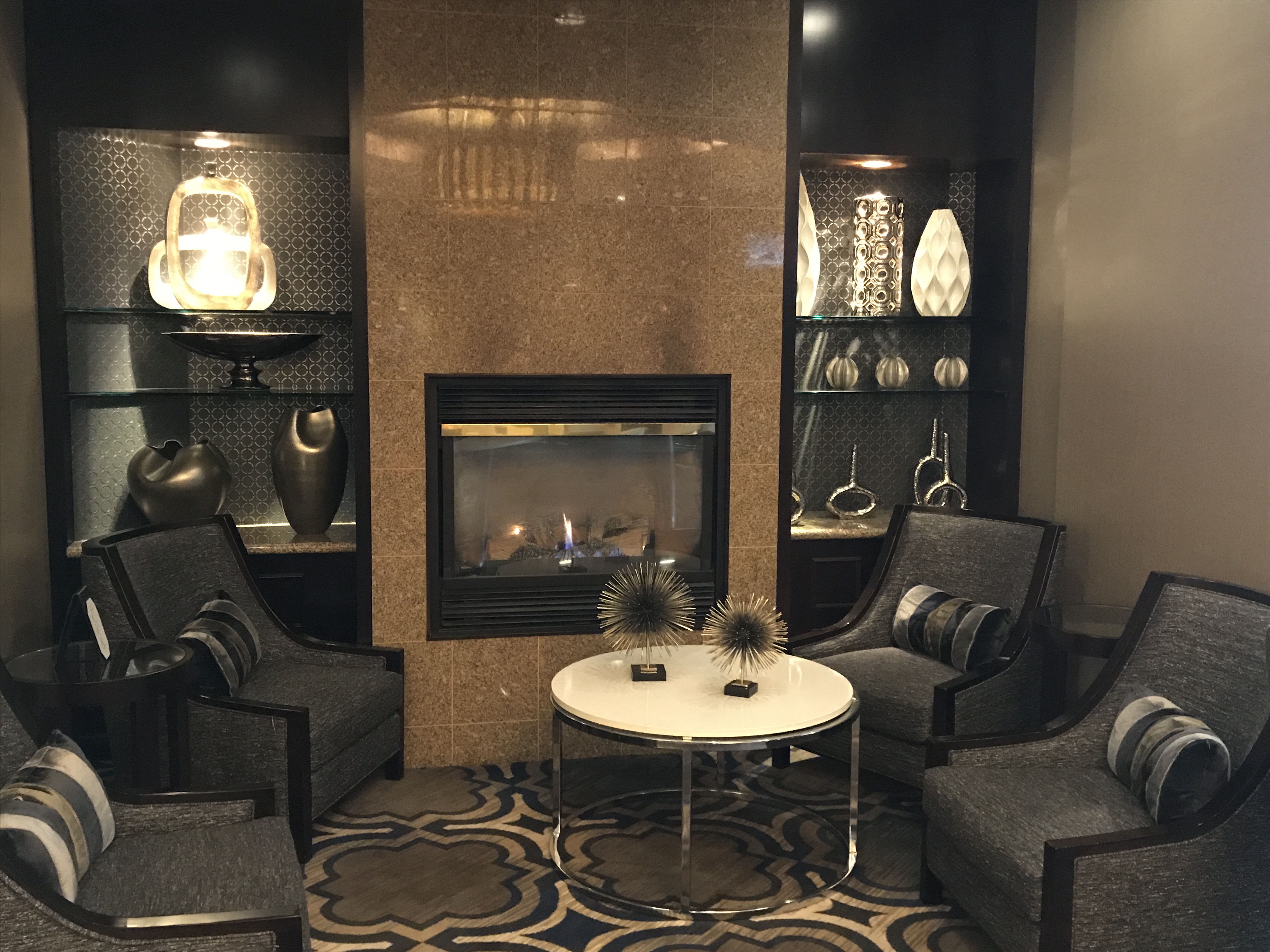 Annapolis Crowne Plaza guest sitting area by a fireplace